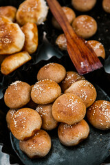 Fresh homemade bread taken from the wood oven. Close up of rustic whole meal bread rolls