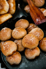 Fresh homemade bread taken from the wood oven. Close up of rustic whole meal bread rolls