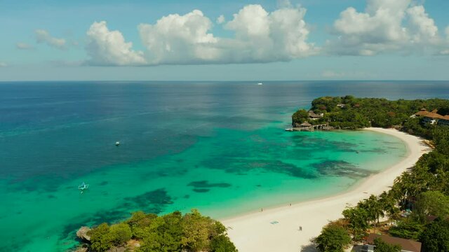 Tropical white sand beach, hotels near the blue lagoon and corall reef. aerial view, Boracay, Philippines. Seascape with beach on tropical island. Summer and travel vacation concept.