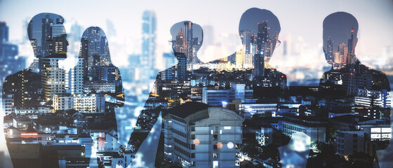 Businesspeople on abstract city background with sunlight. Teamwork and networking concept. Double exposure.