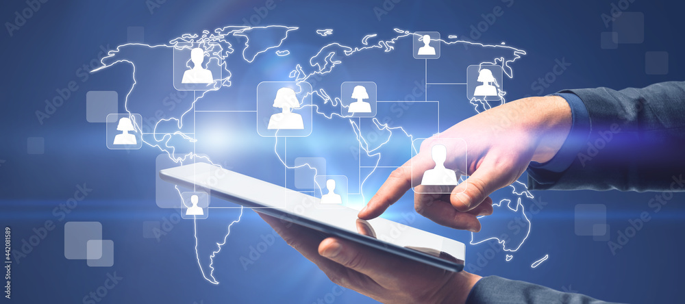 Poster close up of hands using tablet with glowing map and people icons. social media and online recruiting