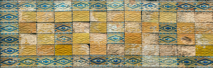 Old yellow ceramic tiles. Old fashioned design