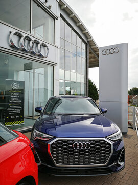 Bridgend, UK: June 27, 2021: Audi Car Dealership Selling New And Used Cars. Audi AG Is A German Automobile Manufacturer And Is A Subsidiary Of Volkswagen Group.