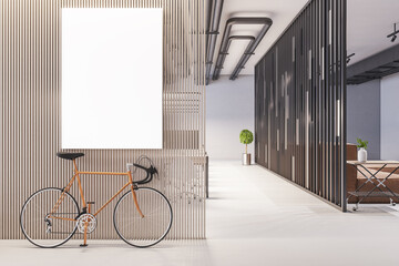 Modern hipster office interior with bike, blank poster on partition wall and furniture. Mock up, 3D...