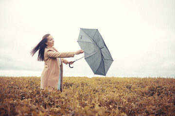 Young girl in autumn park