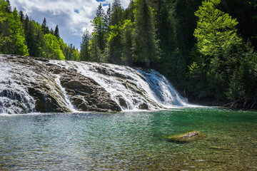 View on the beautiful emerald and transparent water of the Chute de La riviere aux Emeraudes near Percé in Gaspesie (Quebec, Canada)