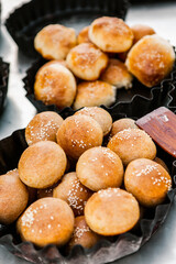 Fresh homemade bread taken from the wood oven. Close up of rustic whole meal bread rolls