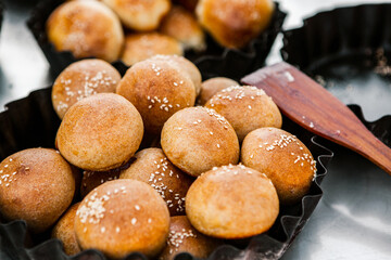 Fresh homemade bread taken from the wood oven. Close up of rustic whole meal bread rolls