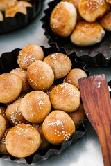 Fresh homemade bread taken from the wood oven. Close up of rustic whole meal bread rolls