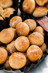 Fresh homemade bread taken from the wood oven. Close up of rustic whole meal bread rolls