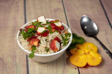 paneer fried rice decorating with capsicum