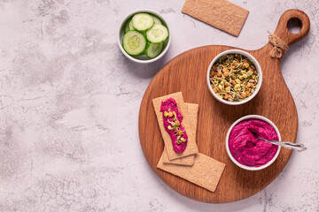 beetroot hummus, sprouted grains, cucumber, and whole grain crisps