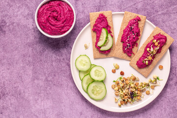 beetroot hummus, sprouted grains, cucumber, and whole grain crisps