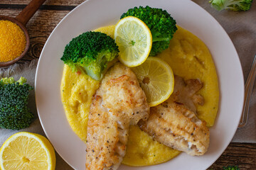 Fried fish with polenta and vegetables