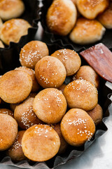 Fresh homemade bread taken from the wood oven. Close up of rustic whole meal bread rolls