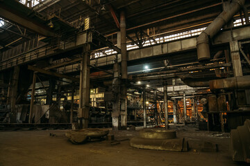 Fototapeta na wymiar Metallurgical plant or factory inside, dark industrial interior.