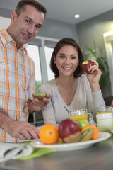 Middle age couple enjoys their healthy breakfast