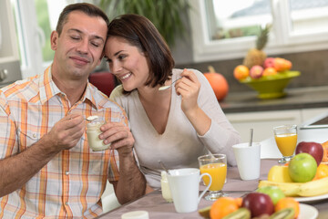 Middle age couple enjoys their healthy breakfast