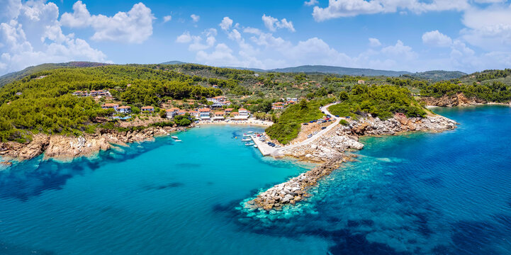Panoramic aerial view to the coast and little fishing village of Katigiorgis, South Pelion, Greece, with turquoise sea © moofushi