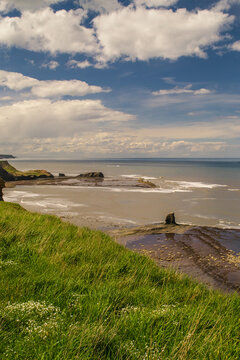 Clifftop view of Saltwick Bay, North Yorkshire Coast. The view includes Black Nab and Saltwick Nab