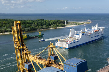 MARITIME TRANSPORT - A passenger ferry, a dredger and  border guard boat in port channel