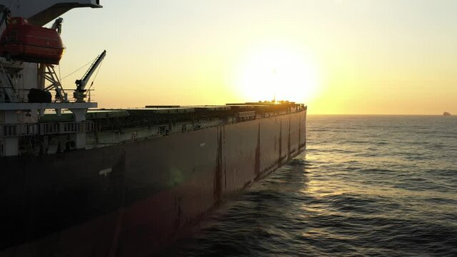4K(24fps) Fly into panamax size bulk carrier vessel.