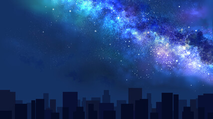 天の川が流れる夜空と街並みのシルエット（ワイド）