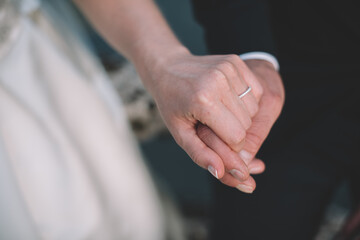 Couple holding hands after getting married