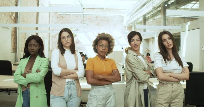 Five multiethnic executive women looking at camera in an office. Business women, empowered woman