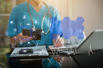 Medical Technology Concepts. Medical students use mobile phones to search for information in a modern office in the morning at the desk.