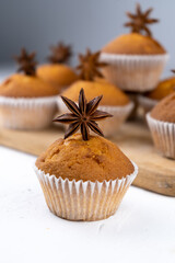 Biscuit muffins close-up. Sweet pastries. Party treat. Dessert on white table - homemade muffins. Portioned cupcakes. Simple muffin
