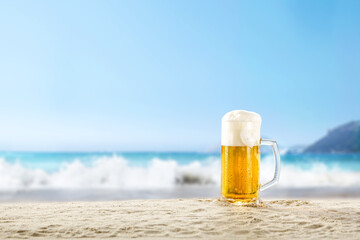 Glass of cold beer and beach landscape 