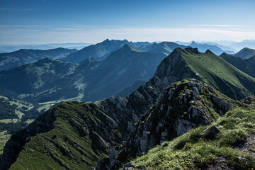 Landscape view of the swiss Alps, with blue sky in the background, shot from the 