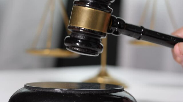  Equipment lawyer gavel being struck to decide an auction or guilty verdict in court