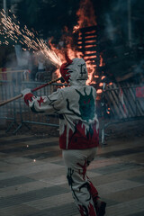 Fototapeta na wymiar Grupo de diablos lanzando fuegos artificiales para fiestas populares