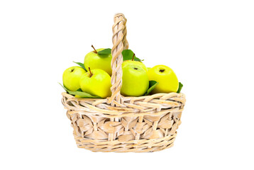 Fresh juicy green apples with leaves in wicker basket on white background. Gardening, summer...
