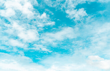 White fluffy clouds on blue sky. Soft touch feeling like cotton. White puffy cloudscape. Beauty in nature. Close-up white altocumulus clouds texture background. Sky on a sunny day. Pure white clouds.