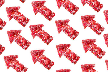 Background made of red beads layed in the shape of arrows, disposed diagonally and isolated on white background. Seamless pattern.