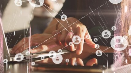 Animation of digital icons over woman using tablet and laptop - Powered by Adobe