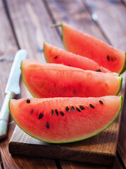 Fresh ripe sliced watermelon on wooden background	
