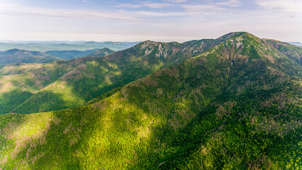 View from above. Russian green taiga. Cloud Mountain in the Primorsky region. One of the highest mountains in Primorye.