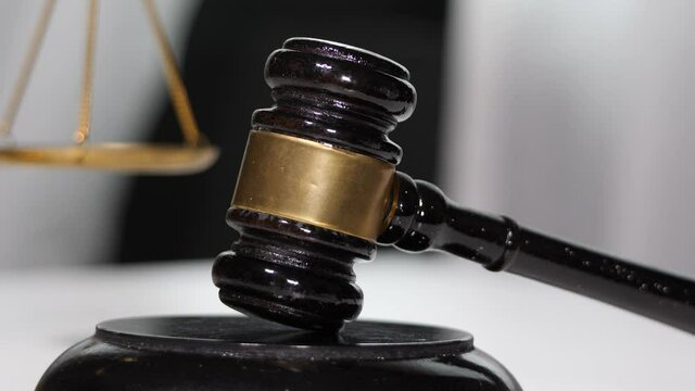  Equipment lawyer gavel being struck to decide an auction or guilty verdict in court