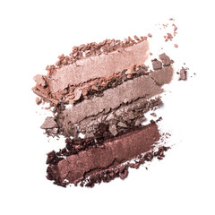 Close-up of make-up swatches. Smears of crushed shiny brown eye shadow