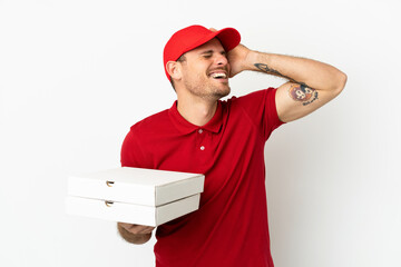 pizza delivery man with work uniform picking up pizza boxes over isolated  white wall smiling a lot