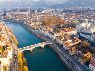 Fototapeta premium Panoramic aerial view of Grenoble city with bridge over Isere river, France