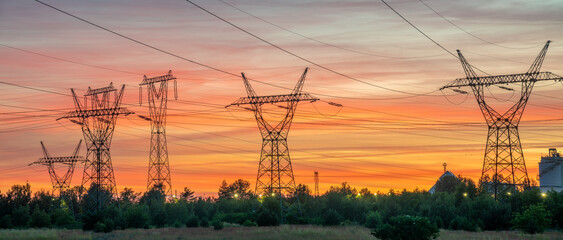High voltage pylons against the background of the evening sky