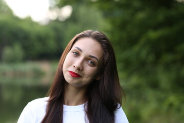 Portrait of beautiful brunette woman outside