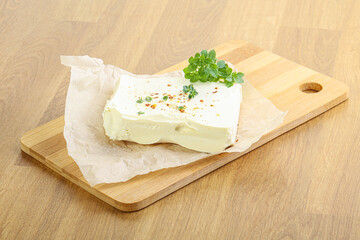 Greek Feta cheese over board