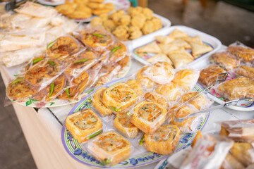 various kinds of traditional Indonesian fries, fried food wrapped in plastic on a serving plate on the table