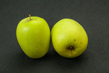Two ripe green sweet apples